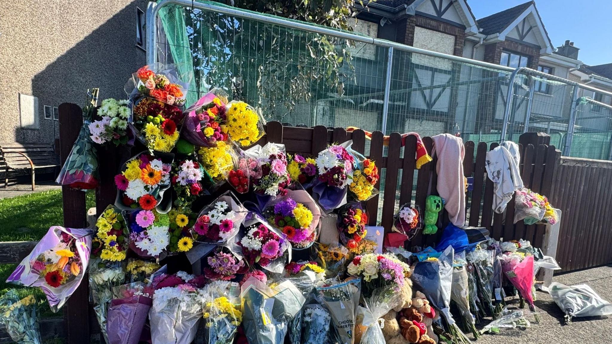 Flowers left at Waterford home after arson