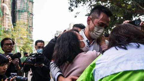 Tragedy Strikes Hong Kong: Families Grieve for Missing After High-Rise Blaze