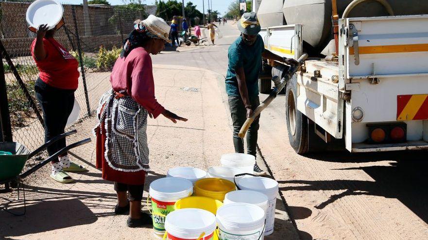 Residents wait for clean drinking water from tankers in Tshwane