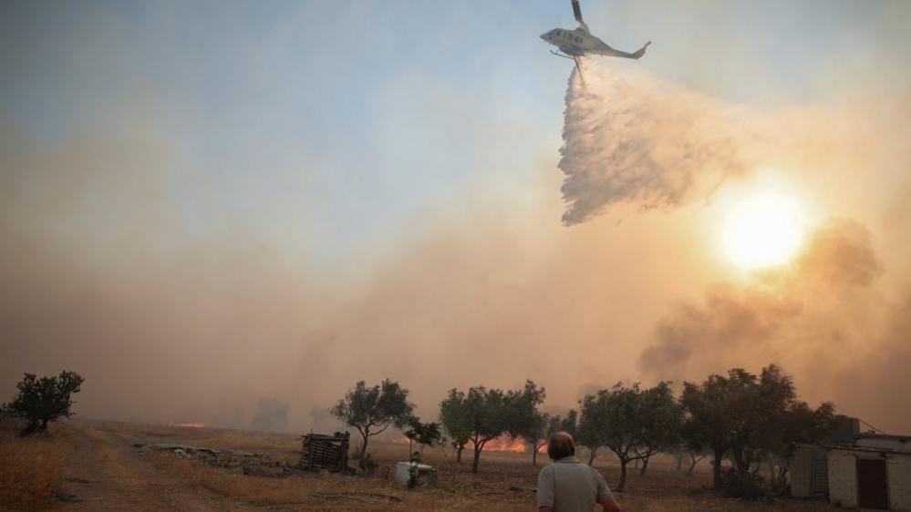 Mid‑air collision leaves helicopter crews injured amid Greece wildfire crisis