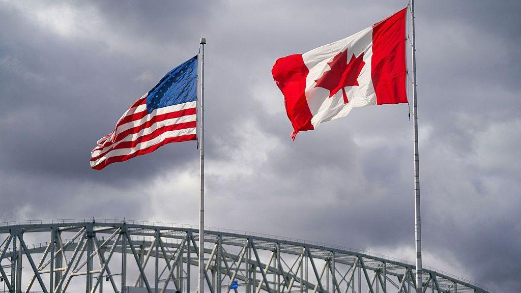 US and Canada flags over the Blue Water Bridge