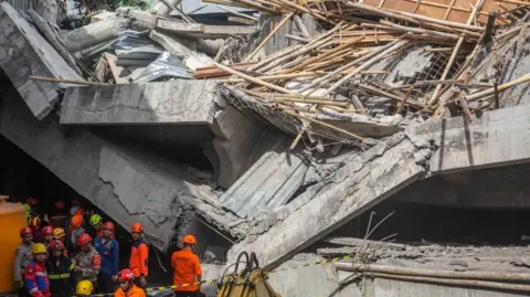 Tragedy Strikes: School Collapse in Indonesia Claims Lives and Traps Many