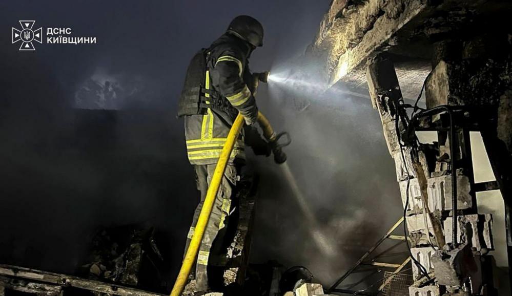 Firefighters assist after Russian strike in Kyiv
