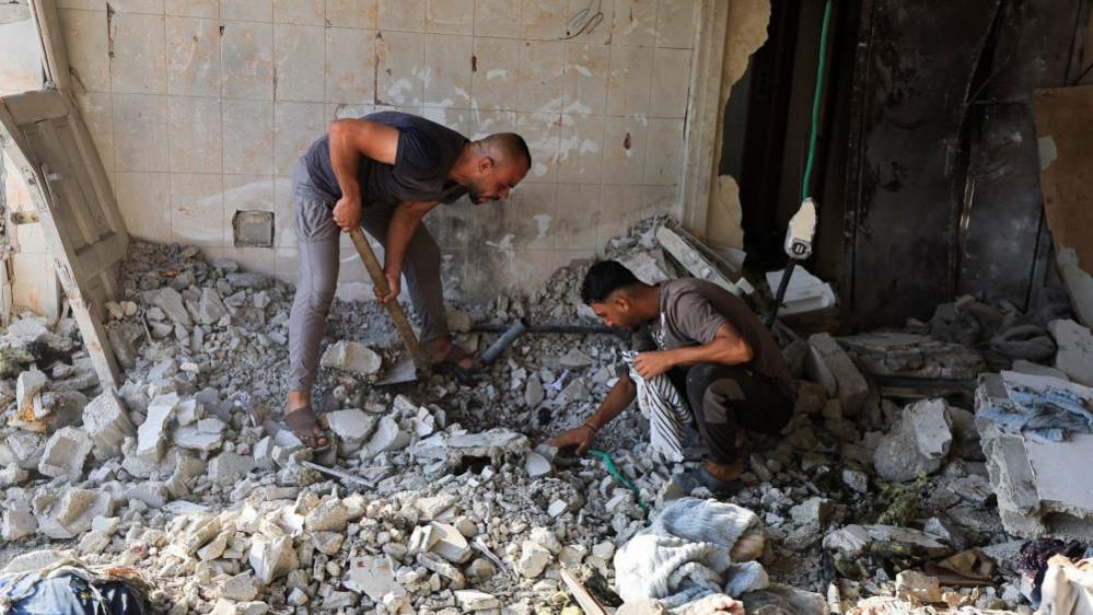 Israeli Strikes Claim 13 Lives as Hamas Begins Disarmament Plan