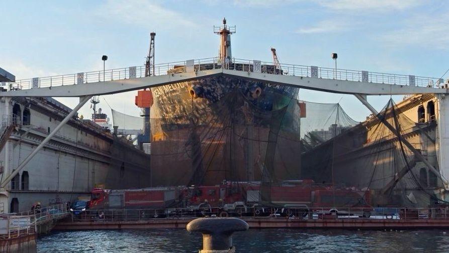 Large cargo ship undergoing maintenance in Qingdao