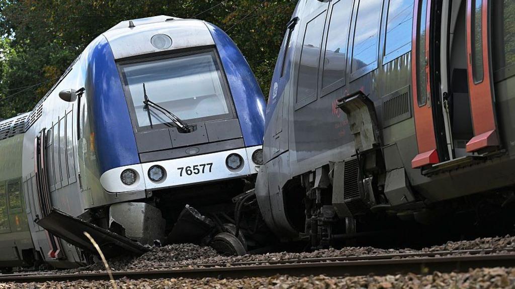 A derailed carriage of a passenger train in Cléon, northern France