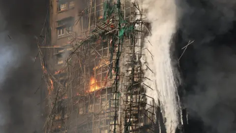 Tragedy in Hong Kong: Firefighters Search for Hundreds Missing in Tower Blaze