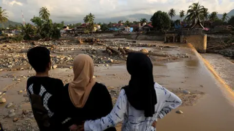 Indonesian Rescuers Battle to Find Hundreds Missing Following Devastating Floods
