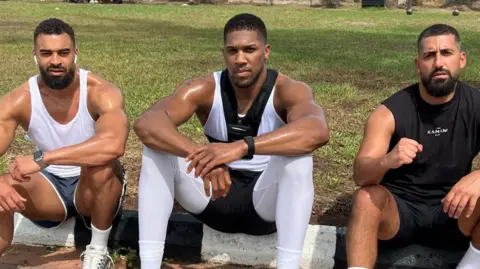 Tragic Car Crash In Nigeria Claims Lives of Anthony Joshua's Team Members