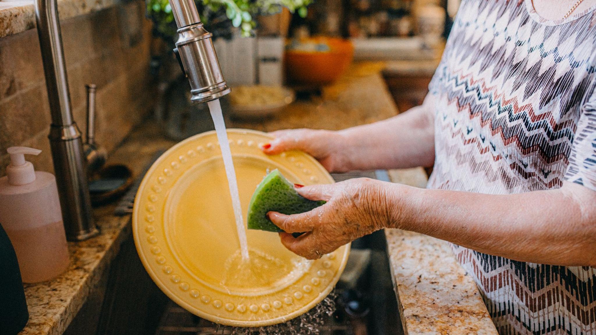 Woman washing dishes